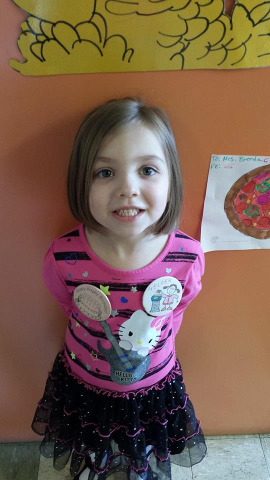 This was yesterday at preschool. She has her helper badge on AND the birthday badge! She was SO PROUD of them!!!